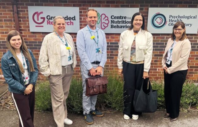 An image of The Grounded Research Team with Dr Tetyana Rocks outside the Grounded Research Hub